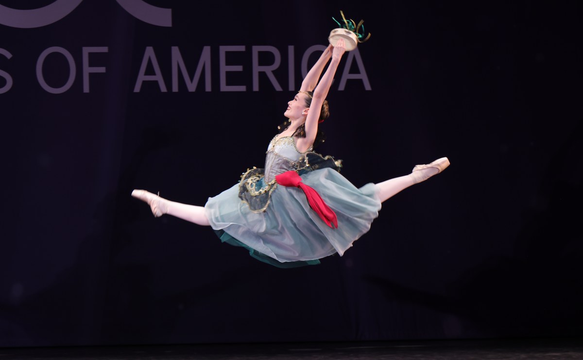 Ballet competition dancer in grand jeté